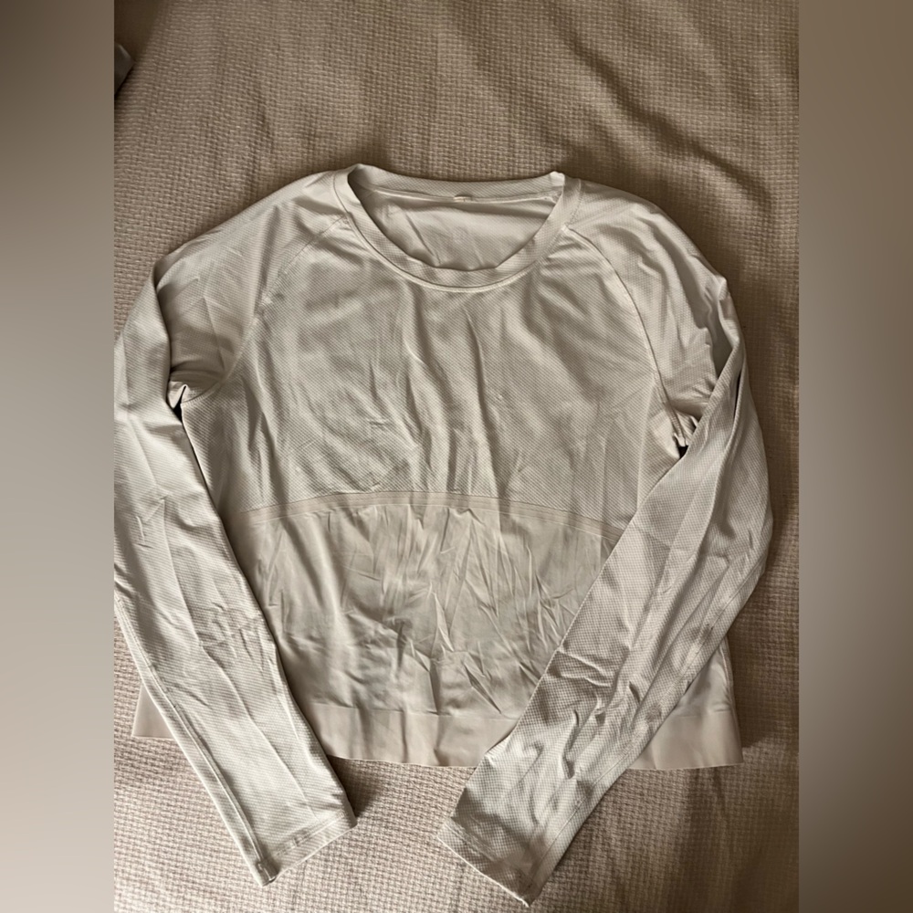 Lululemon: white long sleeved cropped top with light, cold material